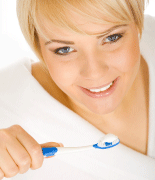 Image of woman and toothbrush